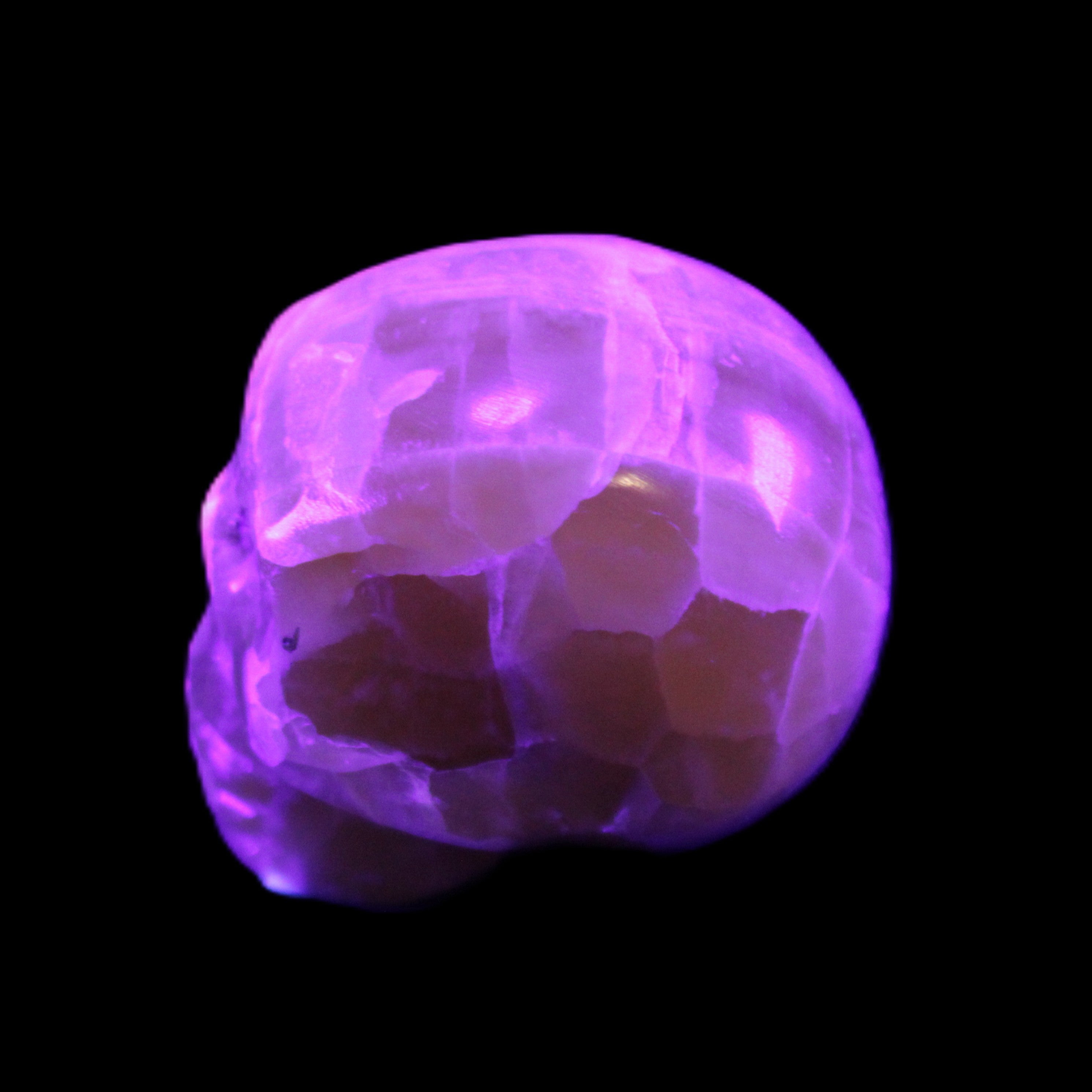 Honeycomb Calcite skull from Pakistan 28*38*34mm 62g in UV light - Rocks and Things Store
