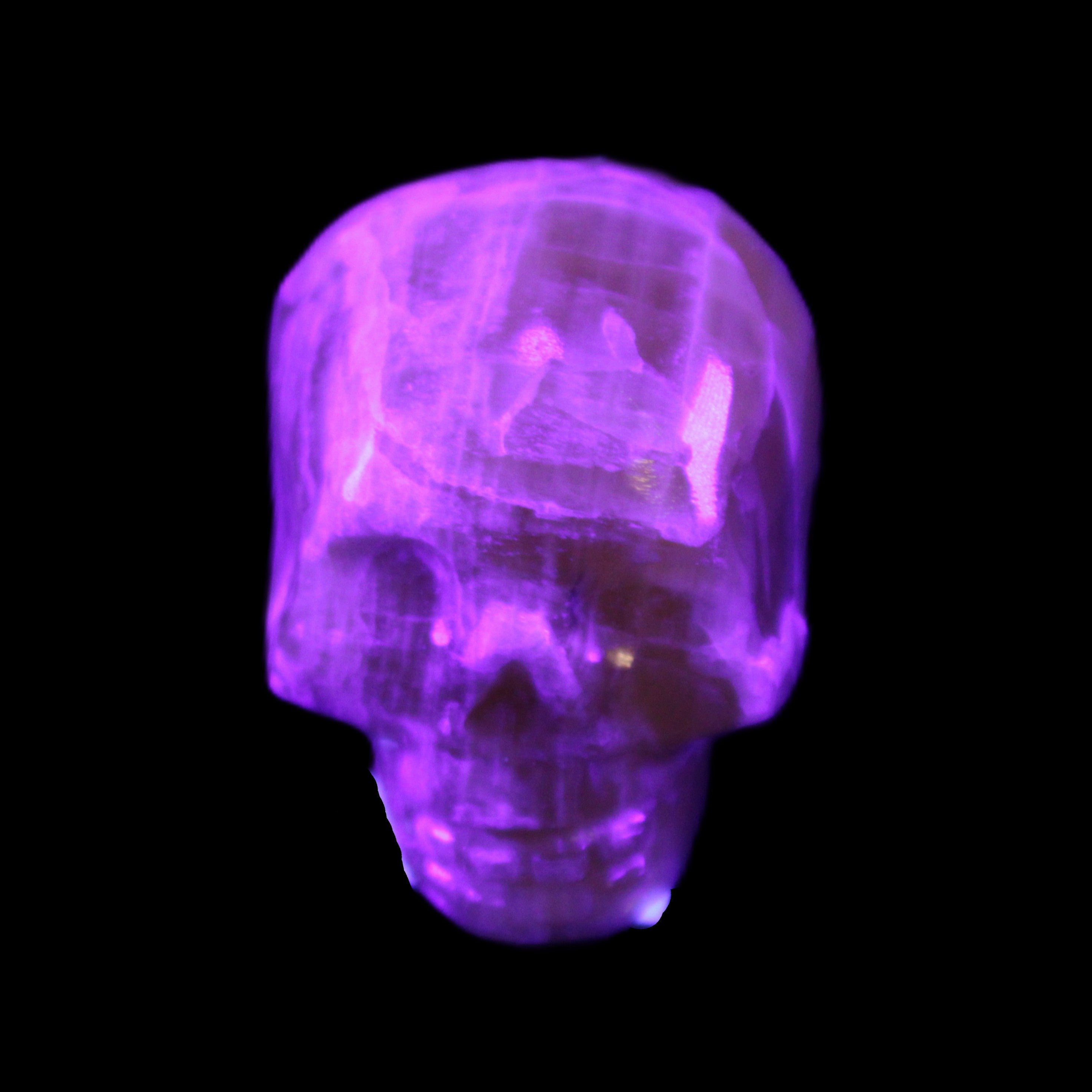Honeycomb Calcite skull from Pakistan 28*38*34mm 62g in UV light - Rocks and Things Store