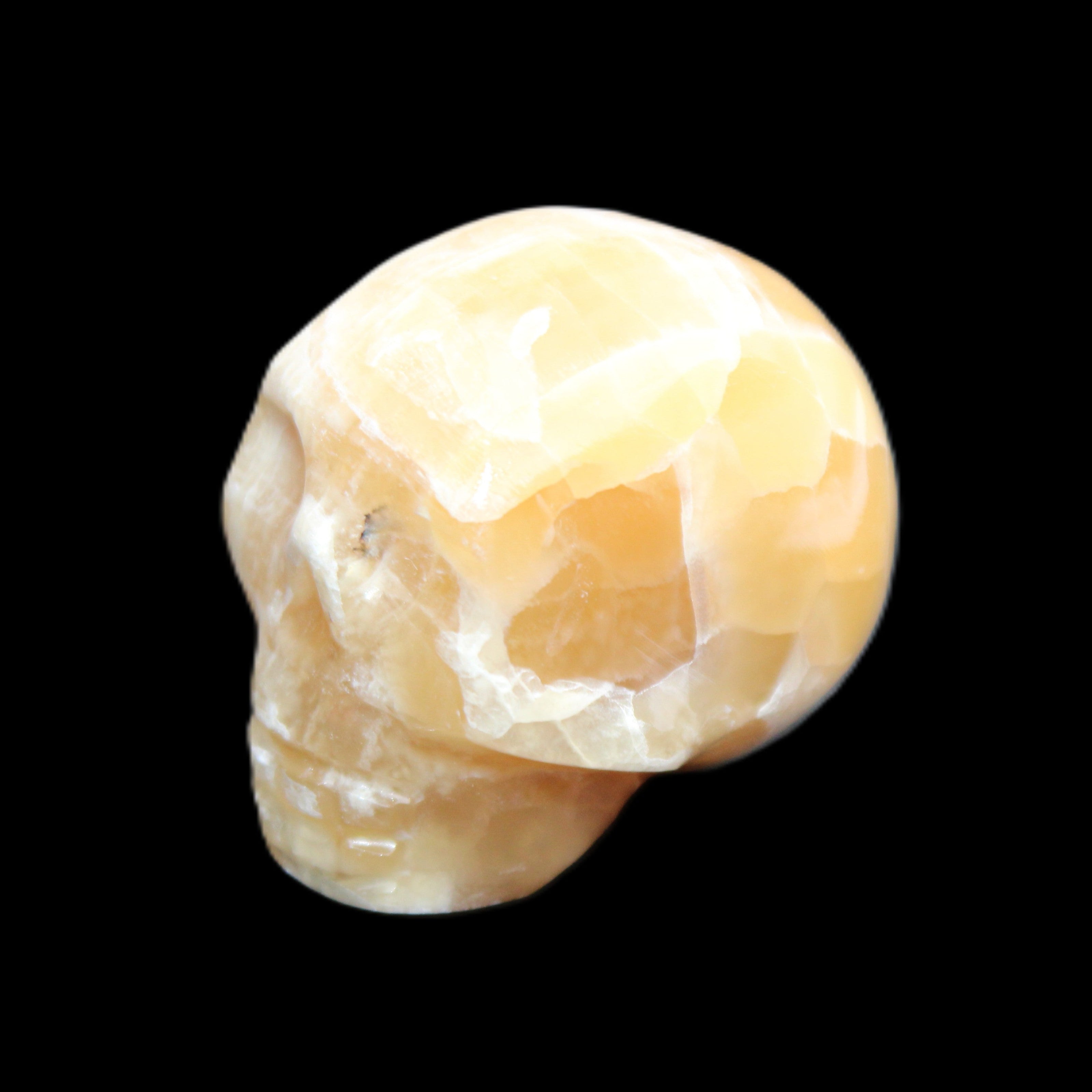 Honeycomb Calcite skull from Pakistan 28*38*34mm 62g in sunlight - Rocks and Things Store