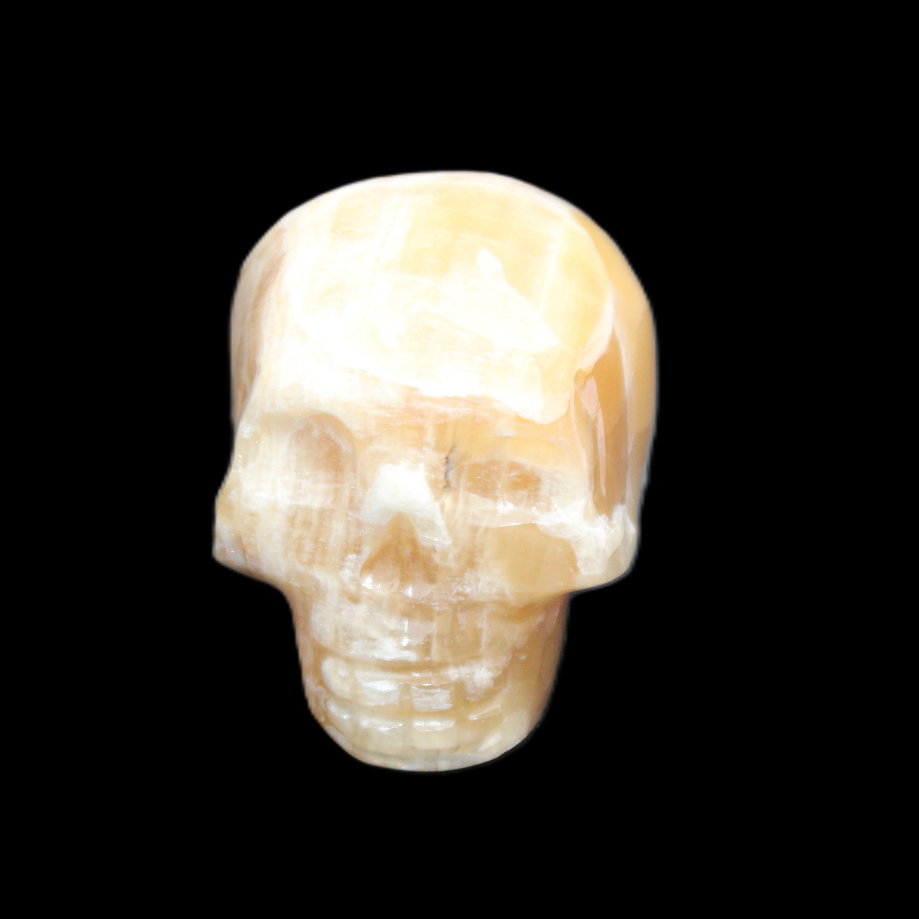 Honeycomb Calcite skull from Pakistan 28*38*34mm 62g in sunlight - Rocks and Things Store