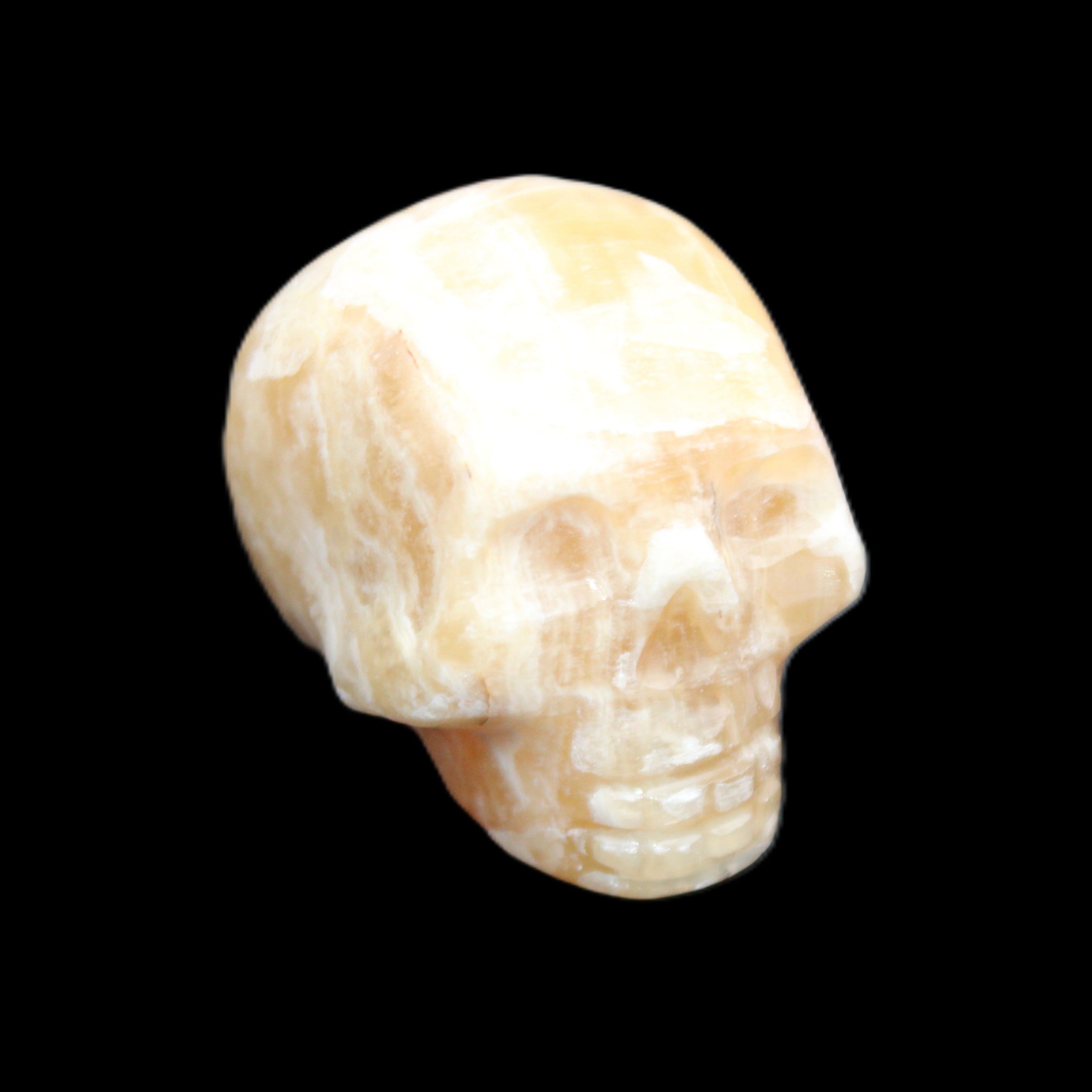 Honeycomb Calcite skull from Pakistan 28*38*34mm 62g in sunlight - Rocks and Things Store