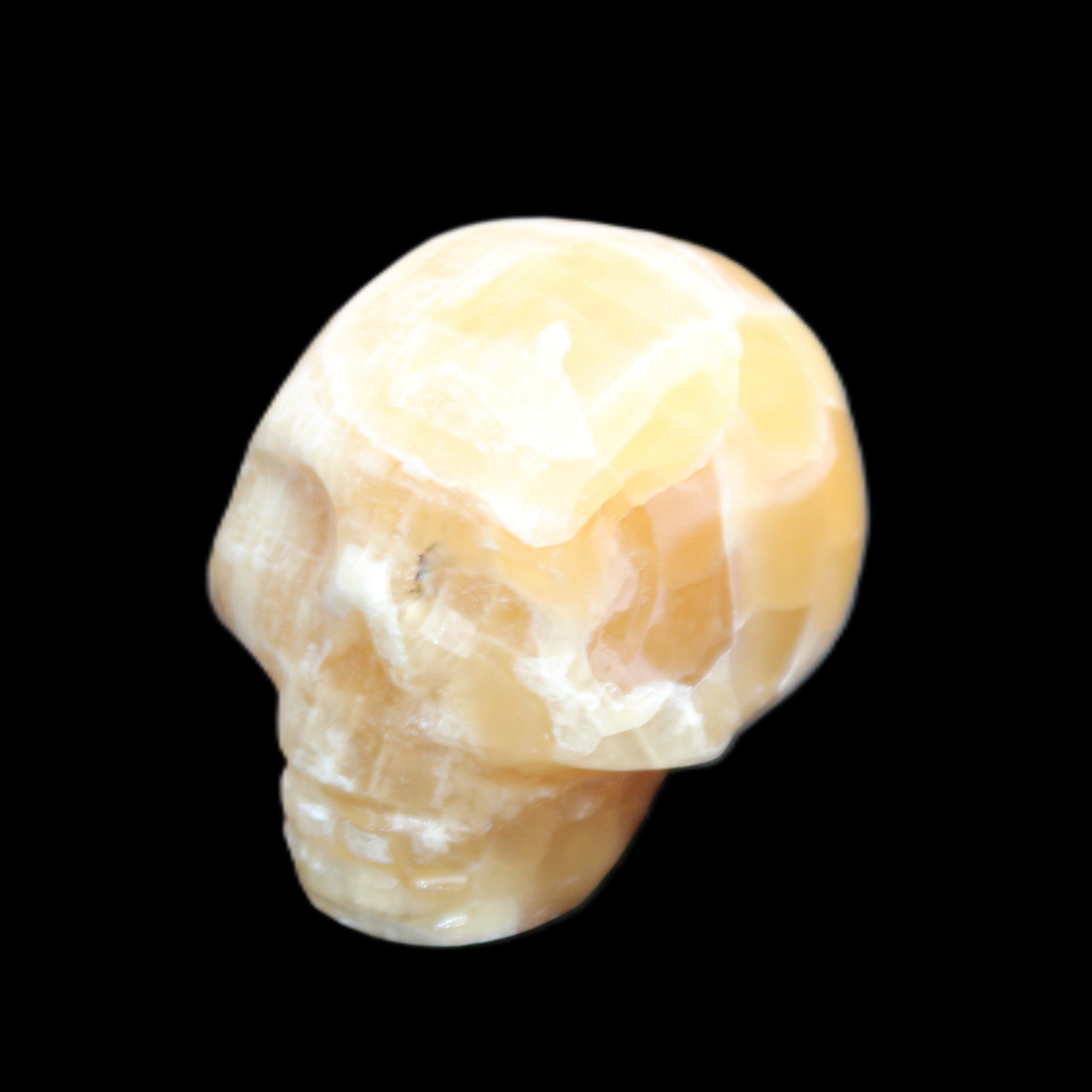 Honeycomb Calcite skull from Pakistan 28*38*34mm 62g in sunlight - Rocks and Things Store