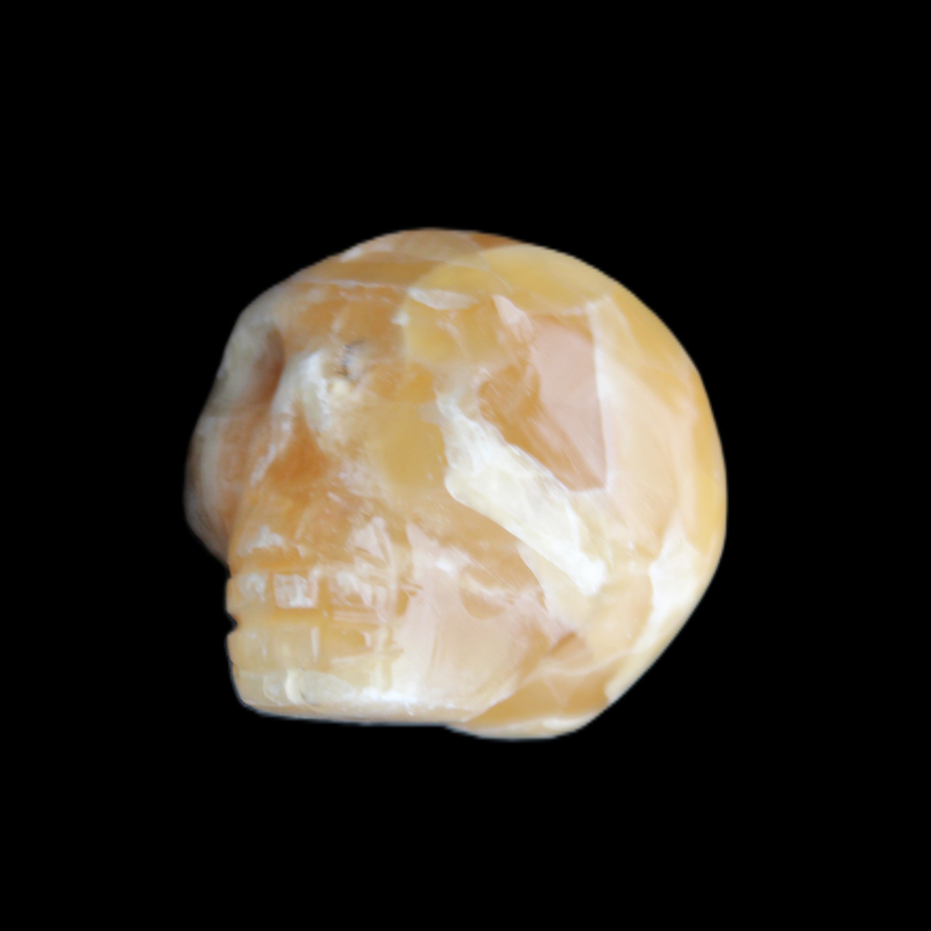 Honeycomb Calcite skull from Pakistan 28*38*34mm 62g in sunlight - Rocks and Things Store