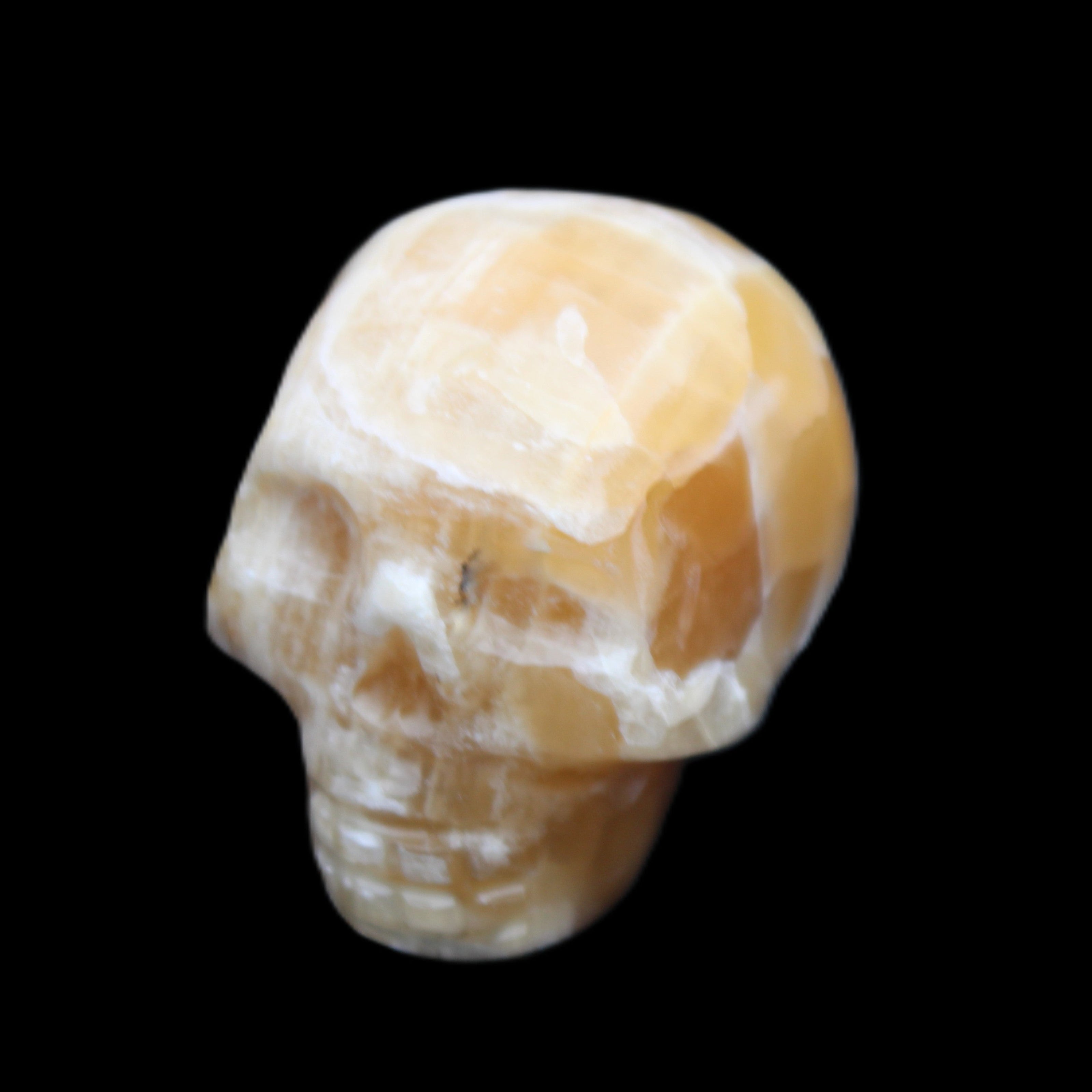 Honeycomb Calcite skull from Pakistan 28*38*34mm 62g in sunlight - Rocks and Things Store