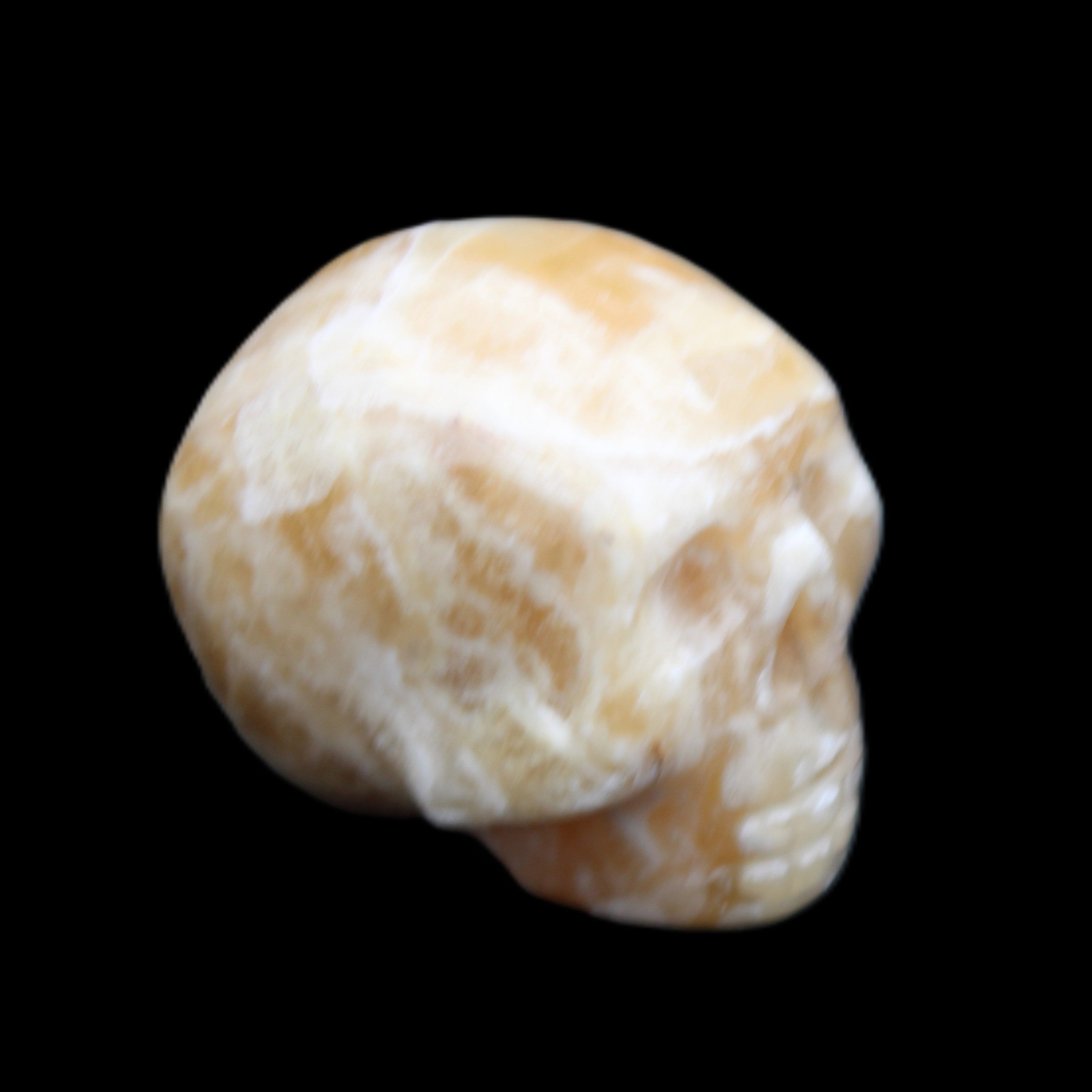 Honeycomb Calcite skull from Pakistan 28*38*34mm 62g in sunlight - Rocks and Things Store