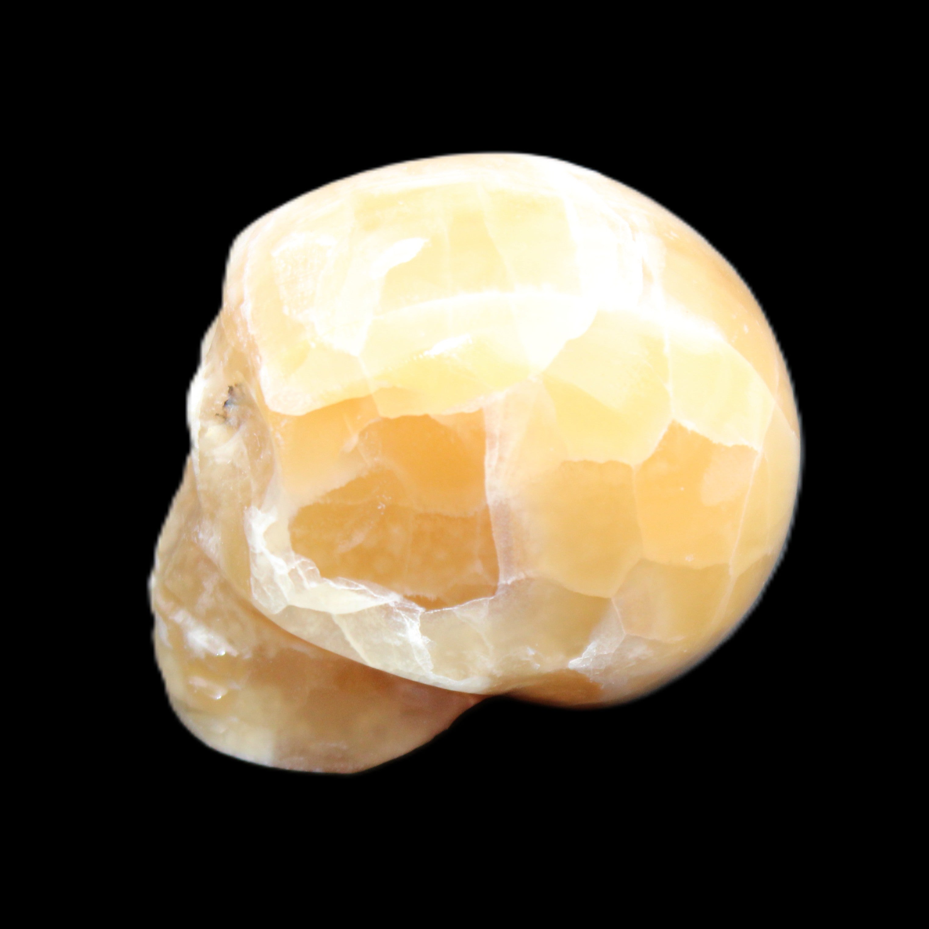 Honeycomb Calcite skull from Pakistan 28*38*34mm 62g in sunlight - Rocks and Things Store