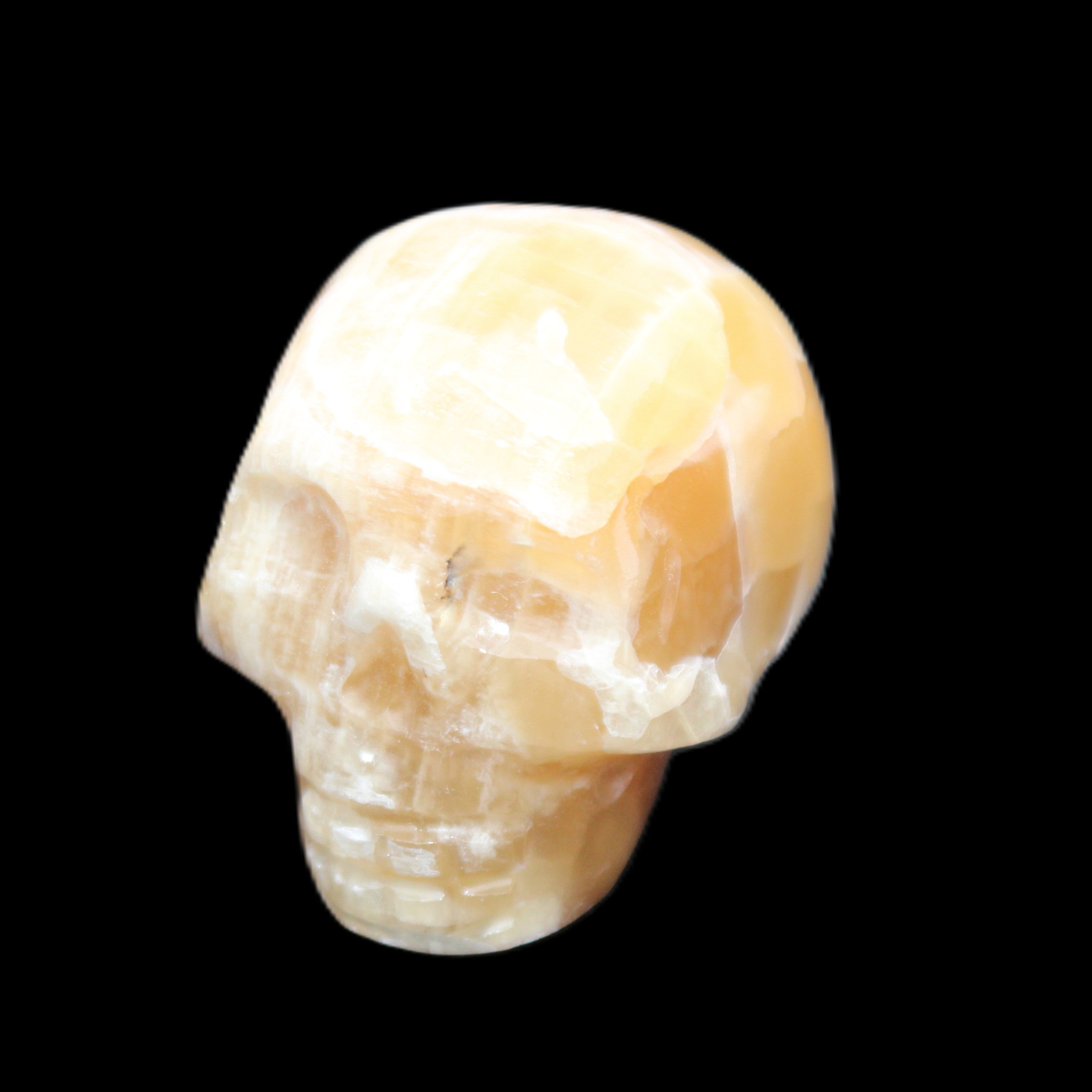 Honeycomb Calcite skull from Pakistan 28*38*34mm 62g in sunlight - Rocks and Things Store