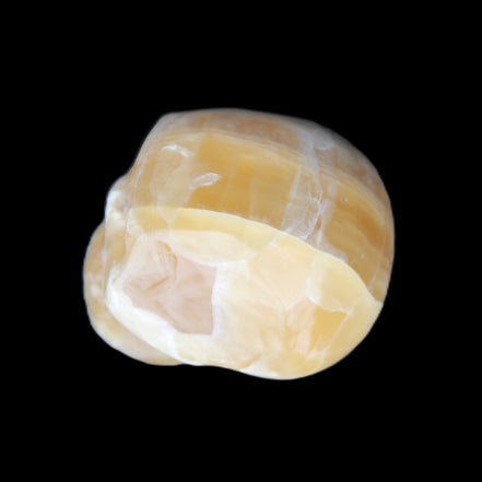 Honeycomb Calcite skull from Pakistan 28*38*34mm 62g in sunlight - Rocks and Things Store