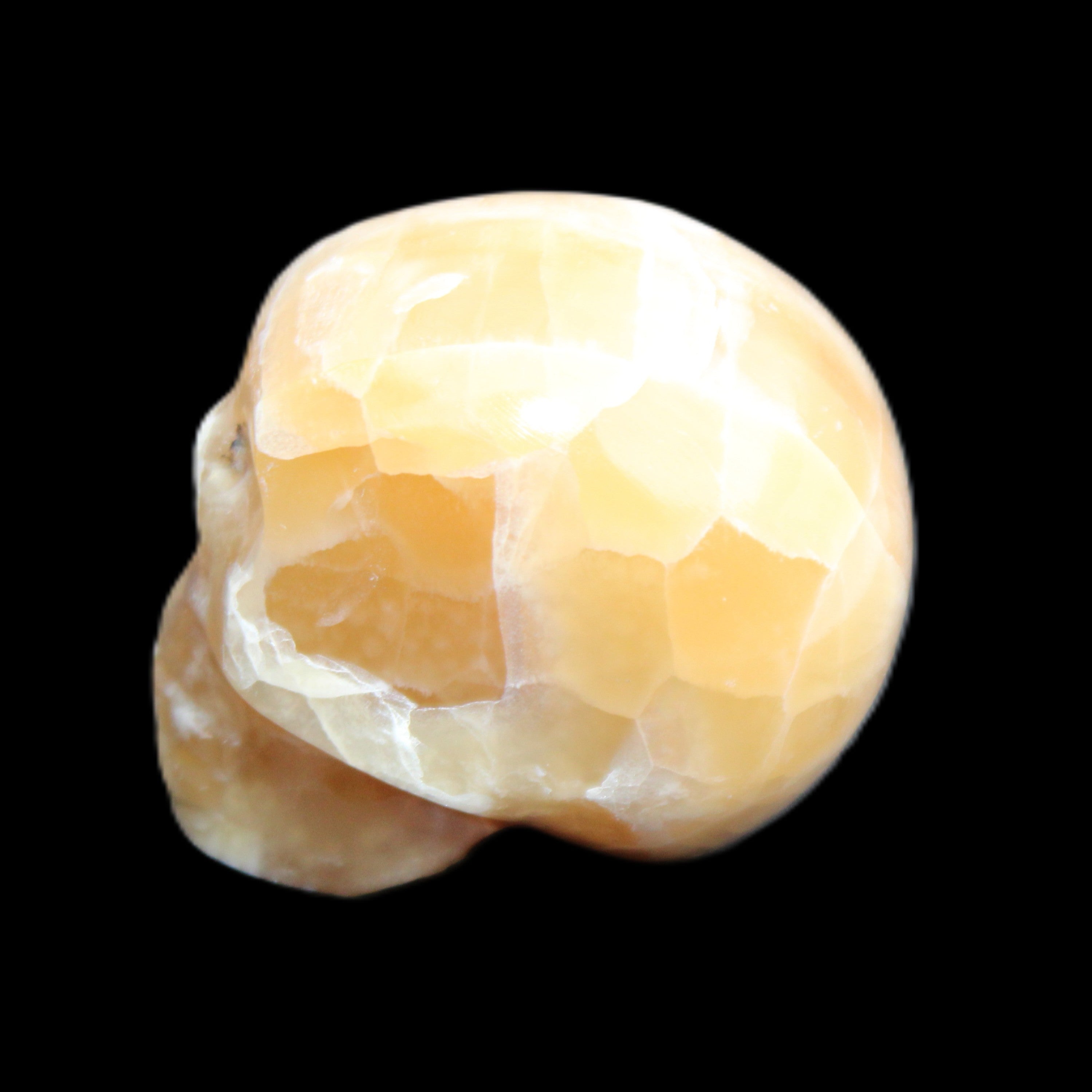 Honeycomb Calcite skull from Pakistan 28*38*34mm 62g in sunlight - Rocks and Things Store
