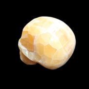 Honeycomb Calcite skull from Pakistan 28*38*34mm 62g in sunlight - Rocks and Things Store