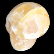 Honeycomb Calcite skull from Pakistan 28*38*34mm 62g in sunlight - Rocks and Things Store