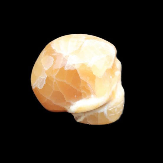 Honey Calcite skull from Pakistan 30*40*35mm 80g in sunlight - Rocks and Things Store