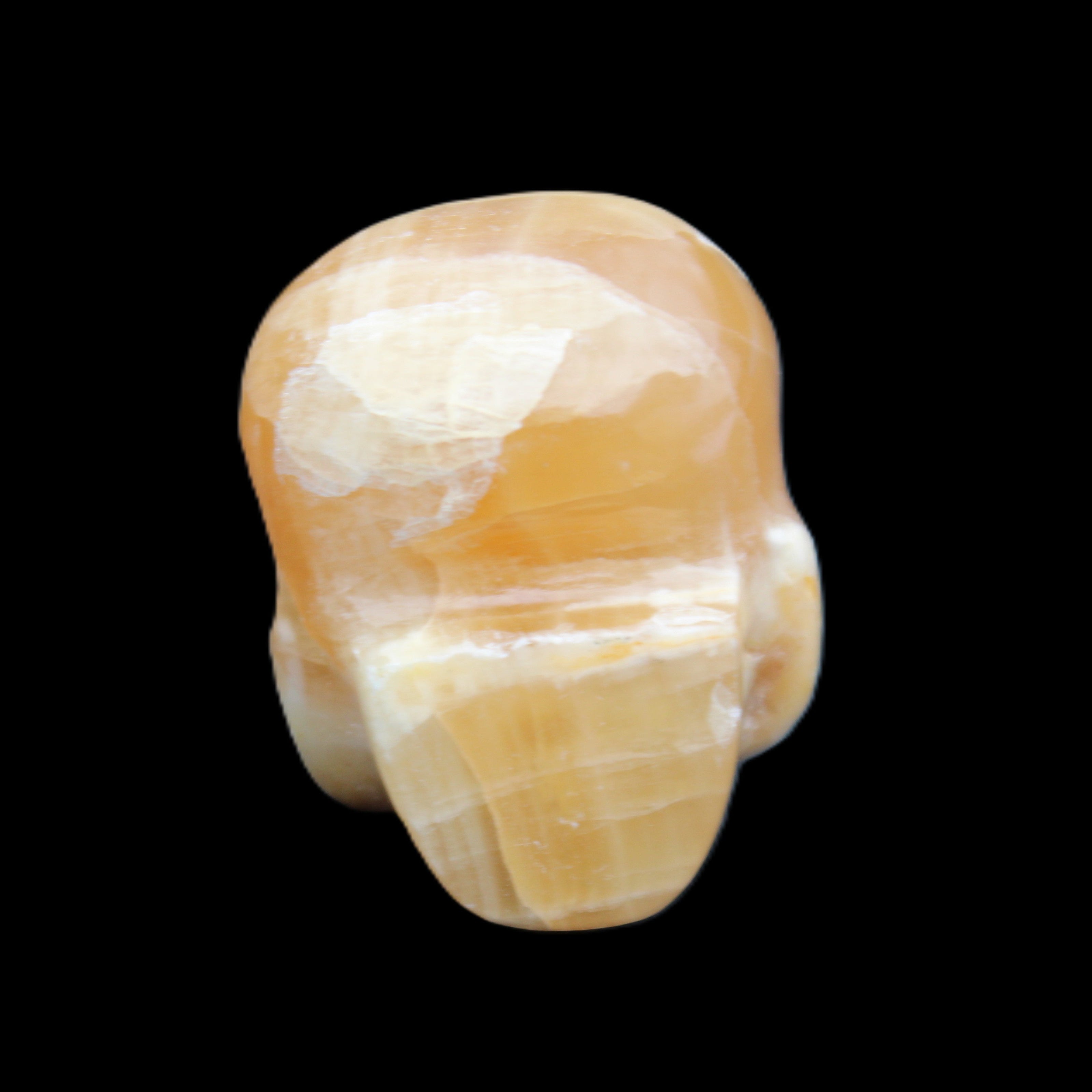 Honey Calcite skull from Pakistan 30*40*35mm 80g in sunlight - Rocks and Things Store