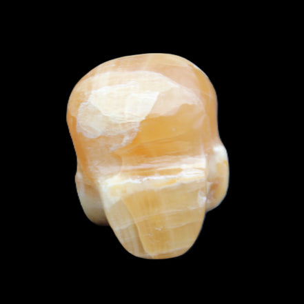 Honey Calcite skull from Pakistan 30*40*35mm 80g in sunlight - Rocks and Things Store