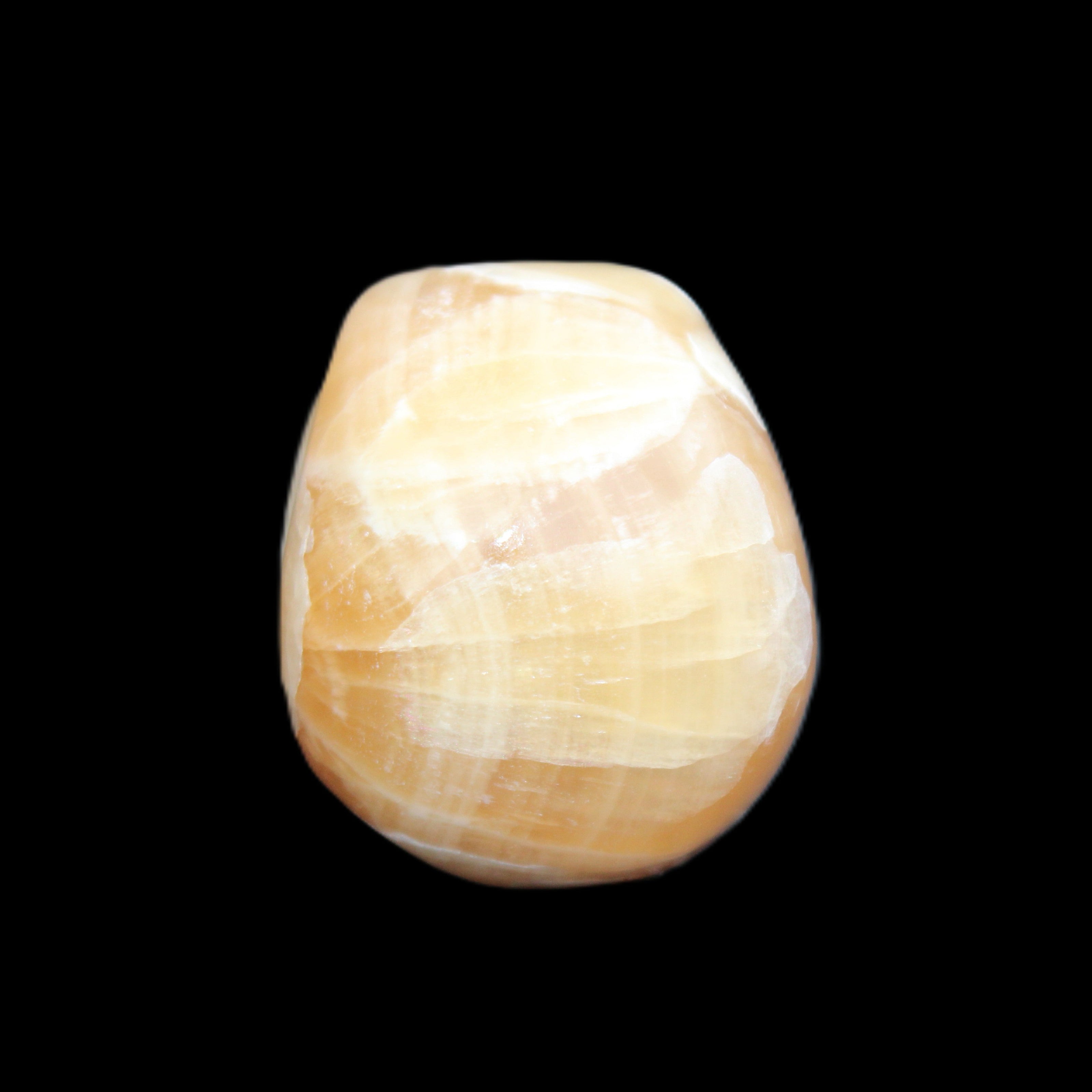 Honey Calcite skull from Pakistan 30*40*35mm 80g in sunlight - Rocks and Things Store