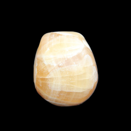 Honey Calcite skull from Pakistan 30*40*35mm 80g in sunlight - Rocks and Things Store