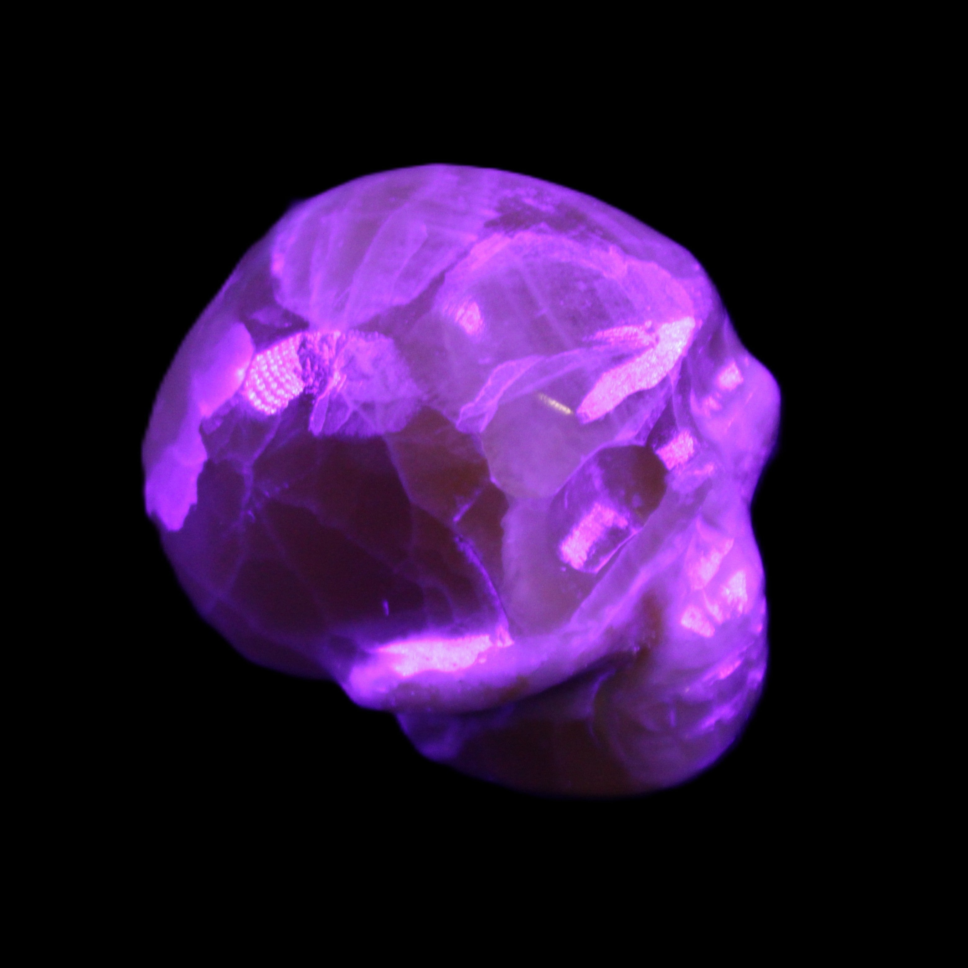 Honey Calcite skull from Pakistan 30*40*35mm 80g in UV light - Rocks and Things Store