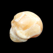 Honey Calcite skull from Pakistan 30*40*35mm 80g in sunlight - Rocks and Things Store