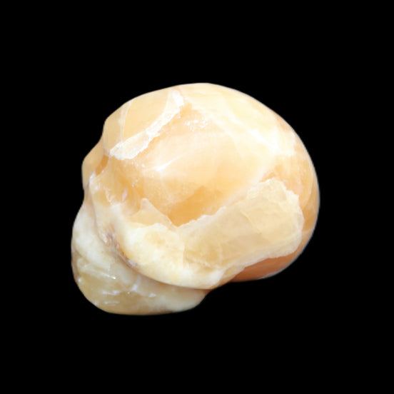 Honey Calcite skull from Pakistan 30*40*35mm 80g in sunlight - Rocks and Things Store