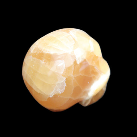 Honey Calcite skull from Pakistan 30*40*35mm 80g in sunlight - Rocks and Things Store