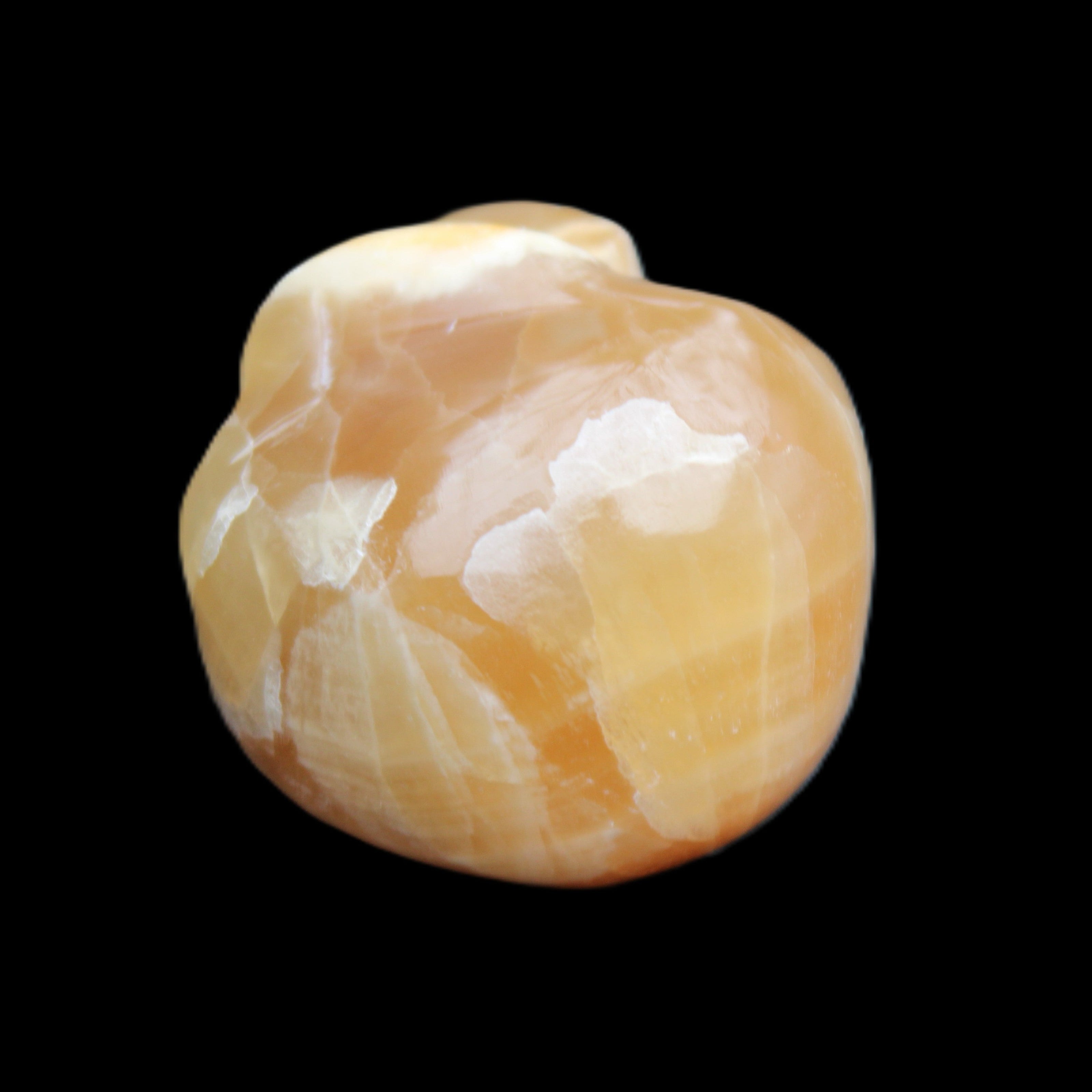 Honey Calcite skull from Pakistan 30*40*35mm 80g in sunlight - Rocks and Things Store