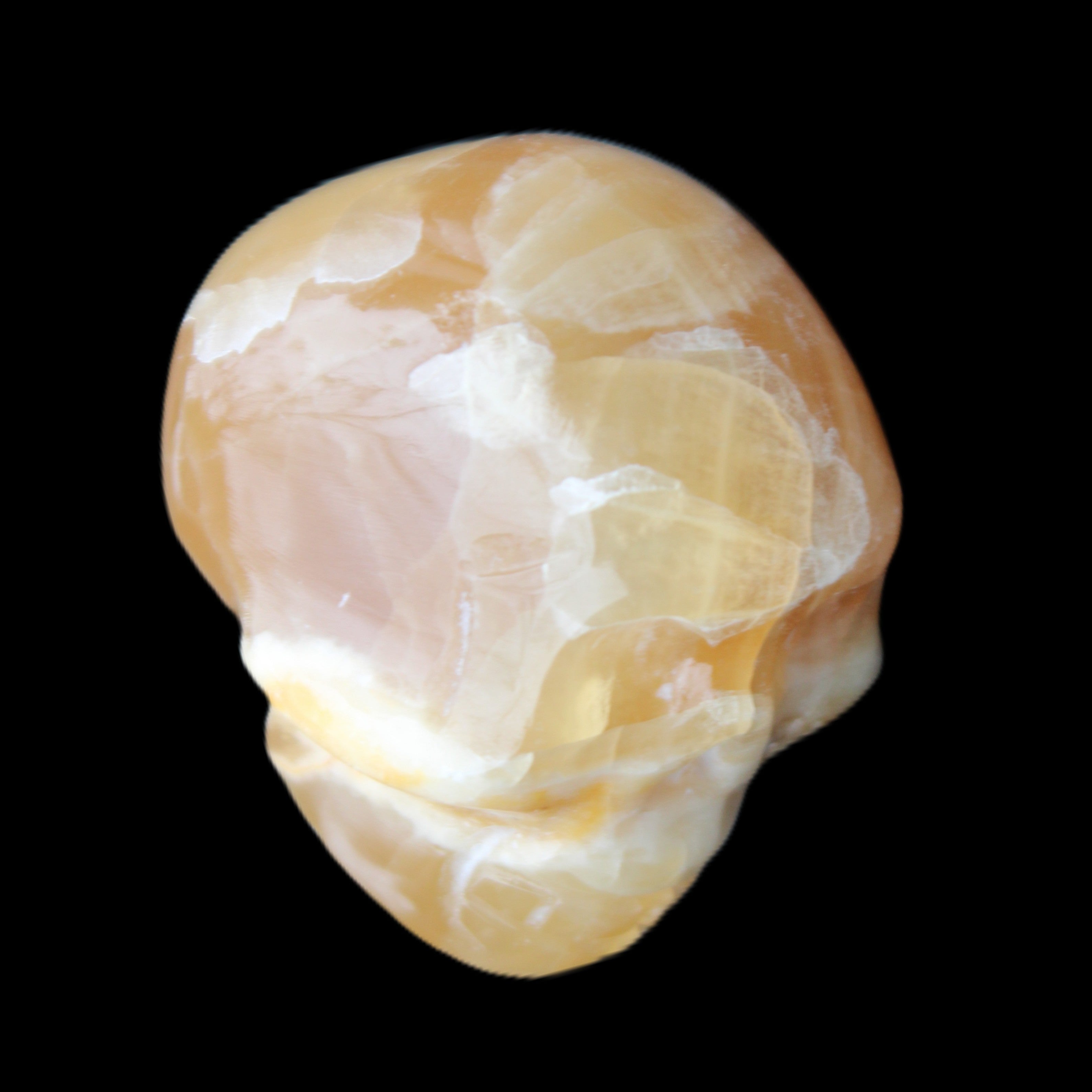 Honey Calcite skull from Pakistan 30*40*35mm 80g in sunlight - Rocks and Things Store