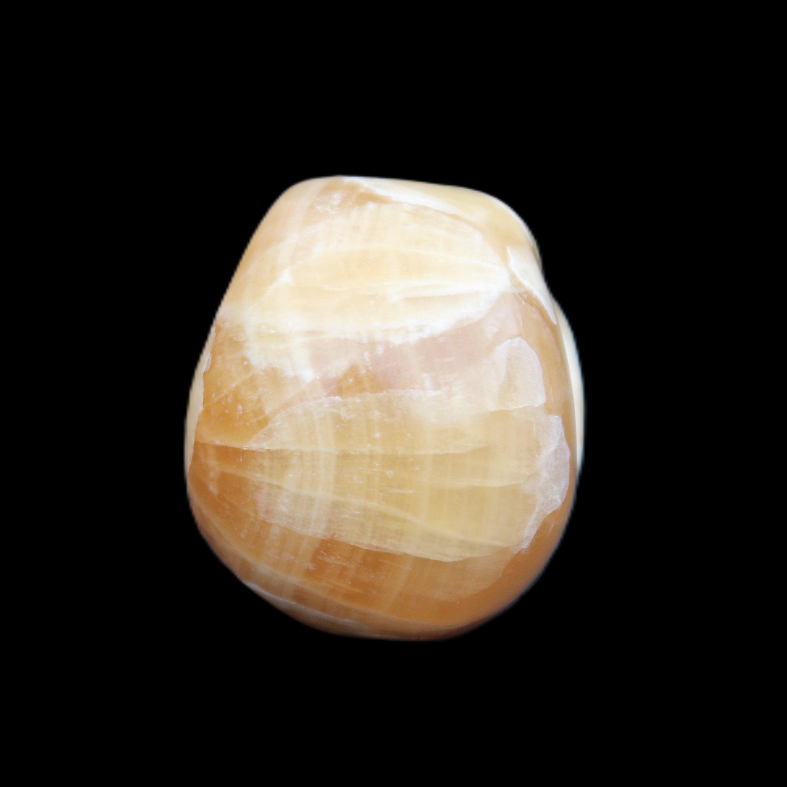 Honey Calcite skull from Pakistan 30*40*35mm 80g in sunlight - Rocks and Things Store