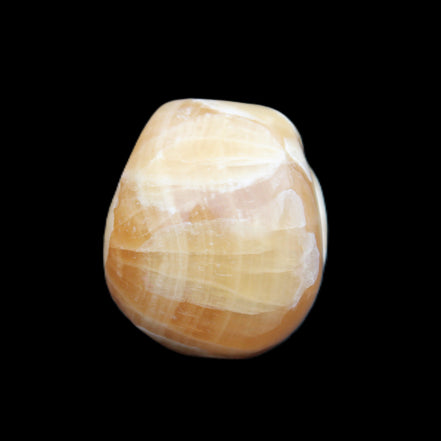 Honey Calcite skull from Pakistan 30*40*35mm 80g in sunlight - Rocks and Things Store