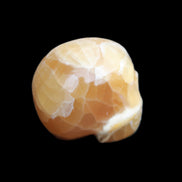 Honey Calcite skull from Pakistan 30*40*35mm 80g in sunlight - Rocks and Things Store