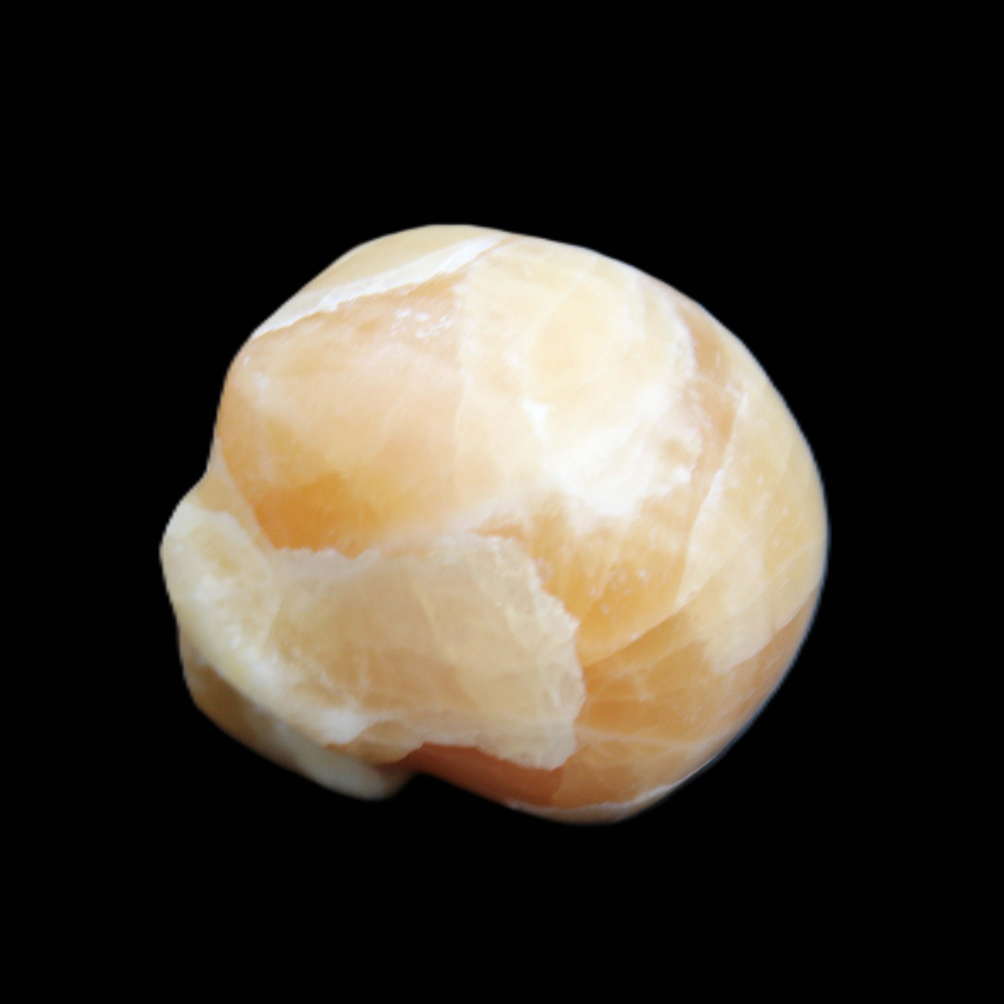 Honey Calcite skull from Pakistan 30*40*35mm 80g in sunlight - Rocks and Things Store