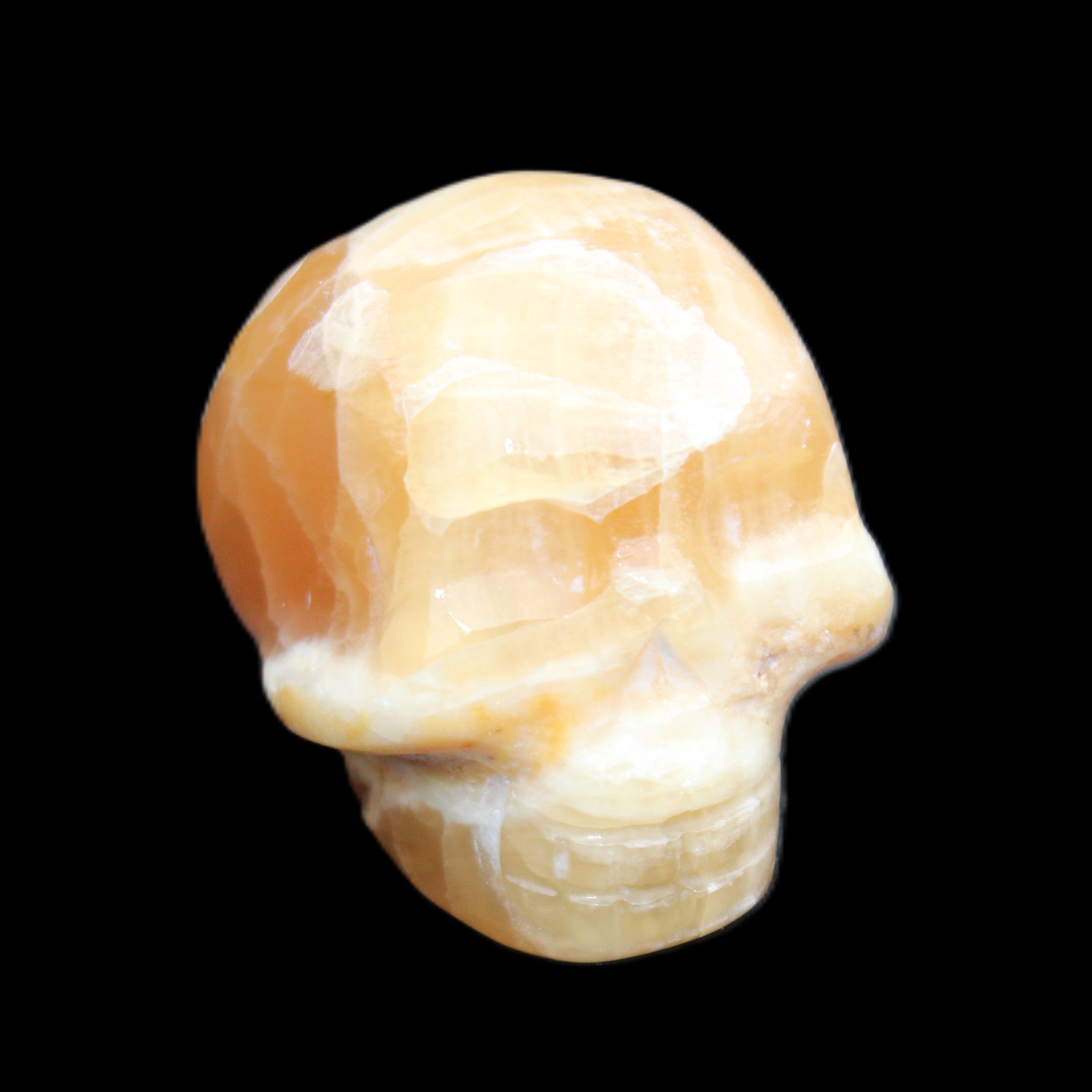 Honey Calcite skull from Pakistan 30*40*35mm 80g in sunlight - Rocks and Things Store