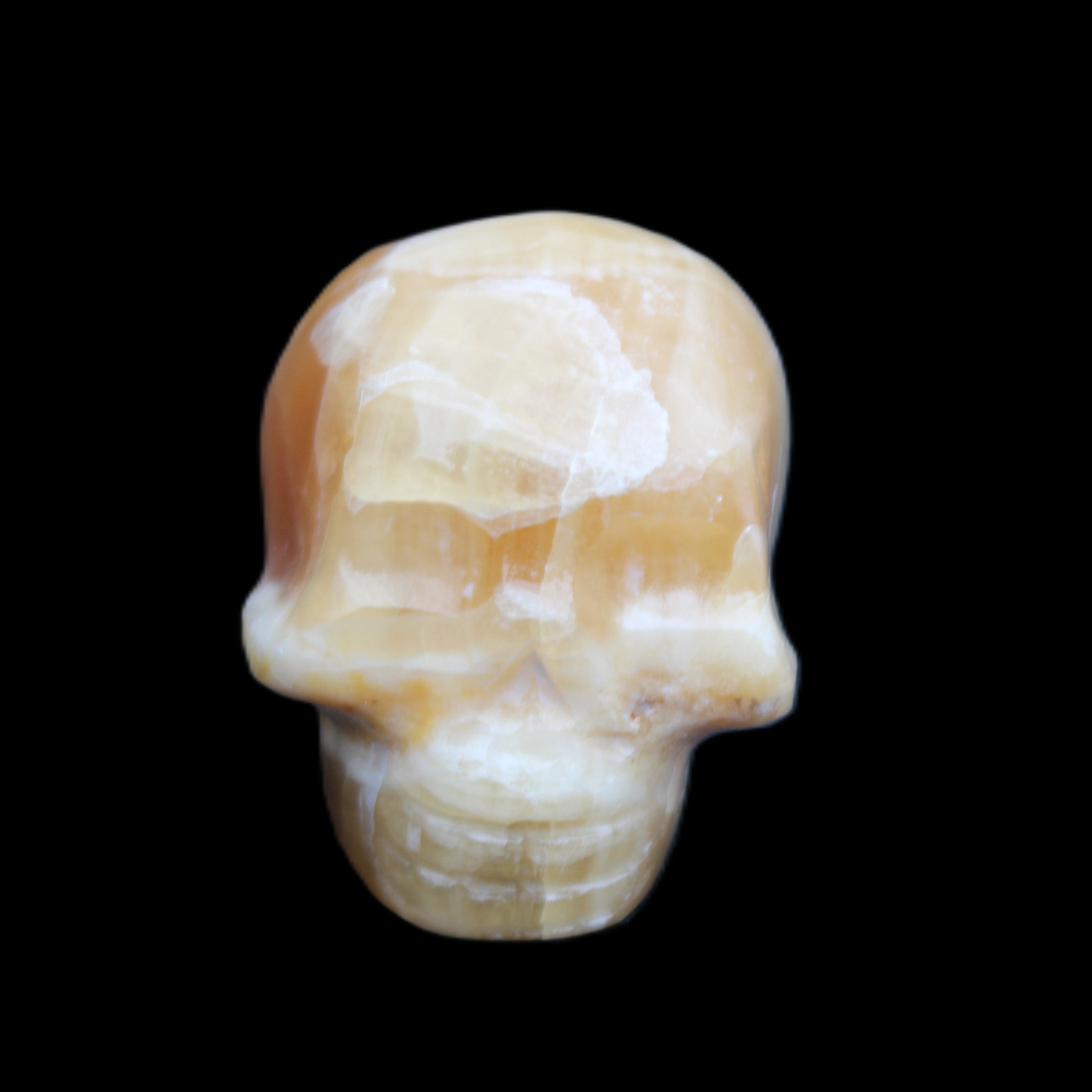 Honey Calcite skull from Pakistan 30*40*35mm 80g in sunlight - Rocks and Things Store
