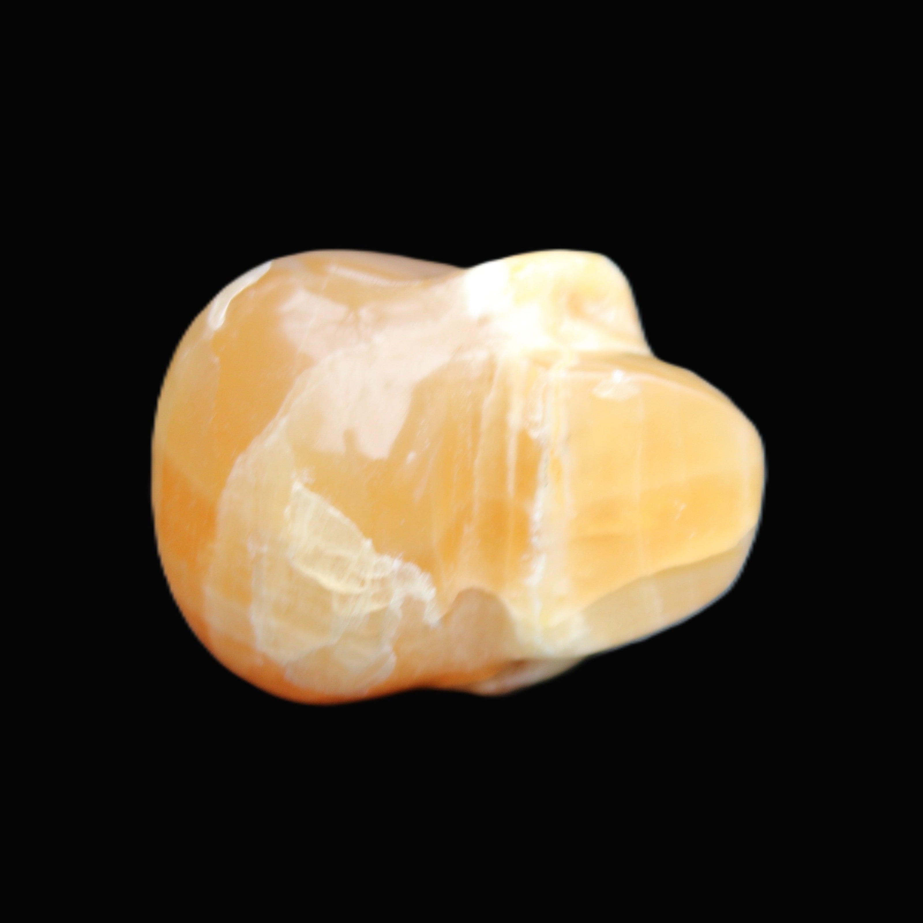 Honey Calcite skull from Pakistan 30*40*35mm 80g in sunlight - Rocks and Things Store