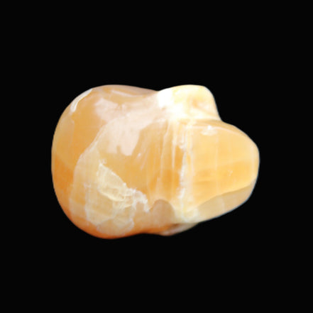 Honey Calcite skull from Pakistan 30*40*35mm 80g in sunlight - Rocks and Things Store