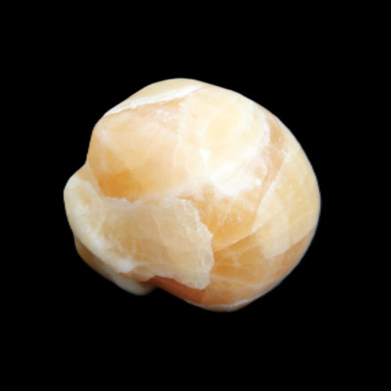 Honey Calcite skull from Pakistan 30*40*35mm 80g in sunlight - Rocks and Things Store