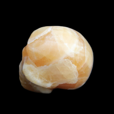 Honey Calcite skull from Pakistan 30*40*35mm 80g in sunlight - Rocks and Things Store