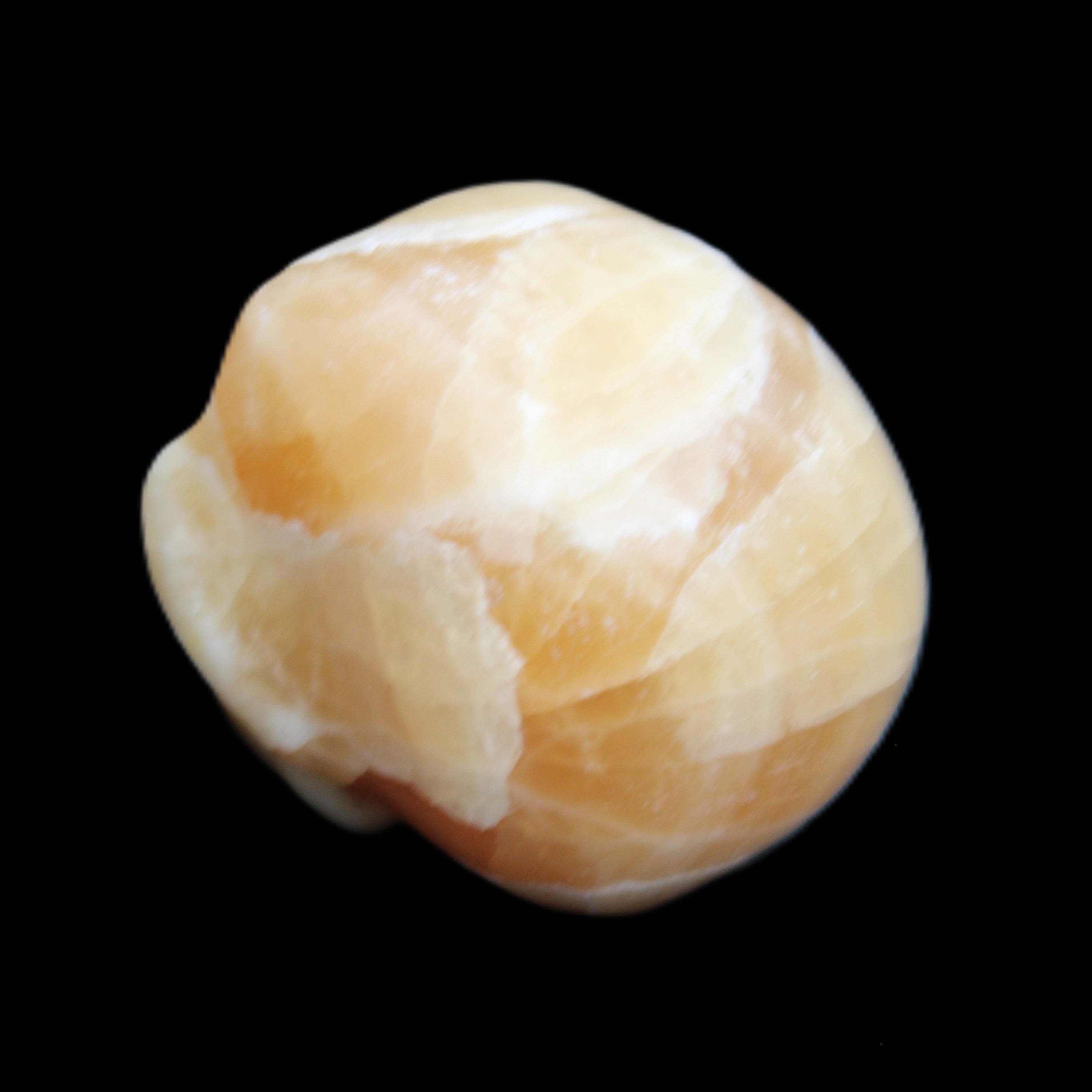 Honey Calcite skull from Pakistan 30*40*35mm 80g in sunlight - Rocks and Things Store