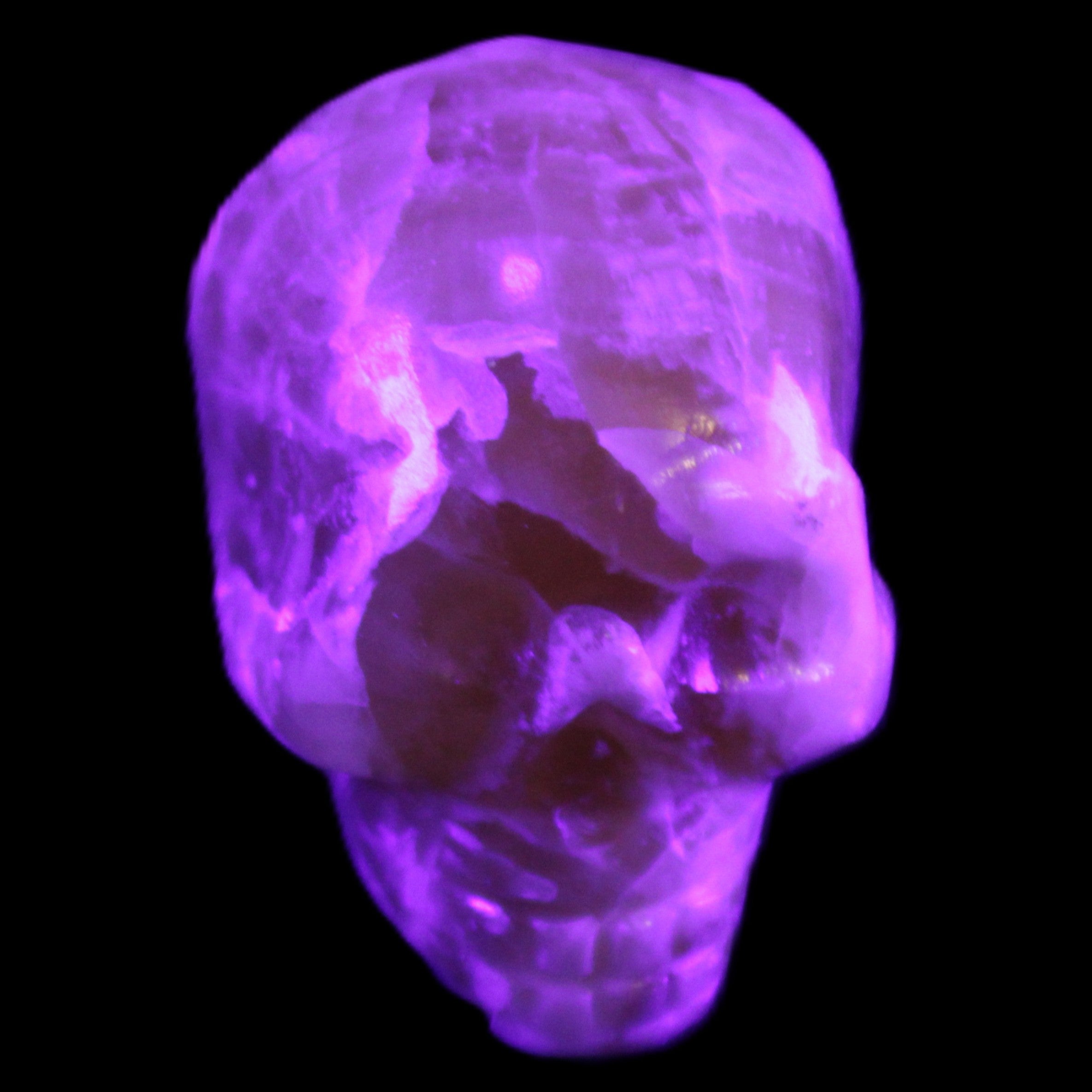 Honey Calcite skull from Pakistan 25*34*33mm 67g in UV light - Rocks and Things Store