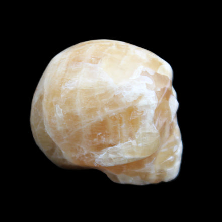 Honey Calcite skull from Pakistan 25*34*33mm 67g in sunlight - Rocks and Things Store