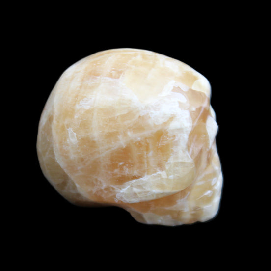 Honey Calcite skull from Pakistan 25*34*33mm 67g in sunlight - Rocks and Things Store