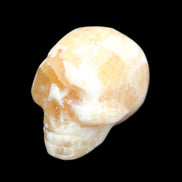 Honey Calcite skull from Pakistan 25*34*33mm 67g in sunlight - Rocks and Things Store