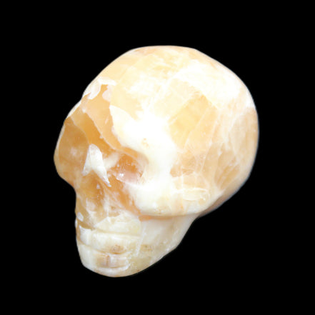 Honey Calcite skull from Pakistan 25*34*33mm 67g in sunlight - Rocks and Things Store