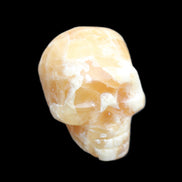 Honey Calcite skull from Pakistan 25*34*33mm 67g in sunlight - Rocks and Things Store