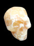 Honey Calcite skull from Pakistan 25*34*33mm 67g in sunlight - Rocks and Things Store