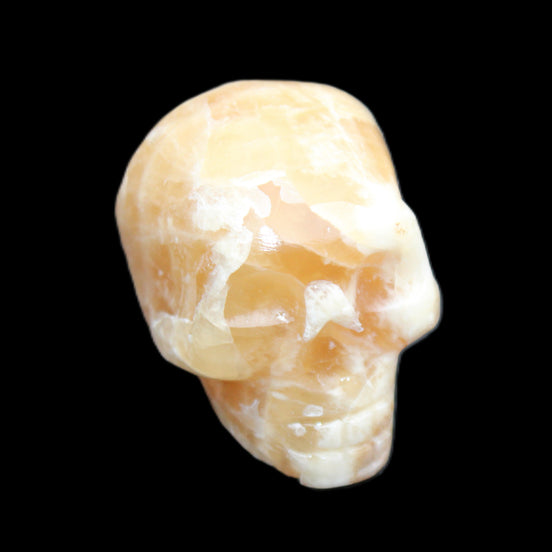Honey Calcite skull from Pakistan 25*34*33mm 67g in sunlight - Rocks and Things Store