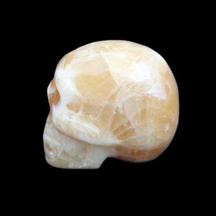 Honey Calcite skull from Pakistan 25*34*33mm 67g in sunlight - Rocks and Things Store