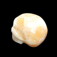 Honey Calcite skull from Pakistan 25*34*33mm 67g in sunlight - Rocks and Things Store