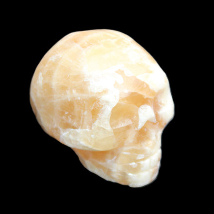 Honey Calcite skull from Pakistan 25*34*33mm 67g in sunlight - Rocks and Things Store