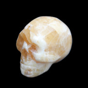 Honey Calcite skull from Pakistan 25*34*33mm 67g in sunlight - Rocks and Things Store