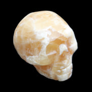 Honey Calcite skull from Pakistan 25*34*33mm 67g in sunlight - Rocks and Things Store
